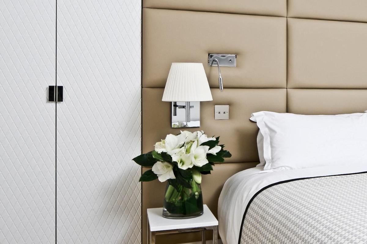 Un ou plusieurs lits dans un hébergement de l'établissement Hôtel R de Paris - Boutique Hotel