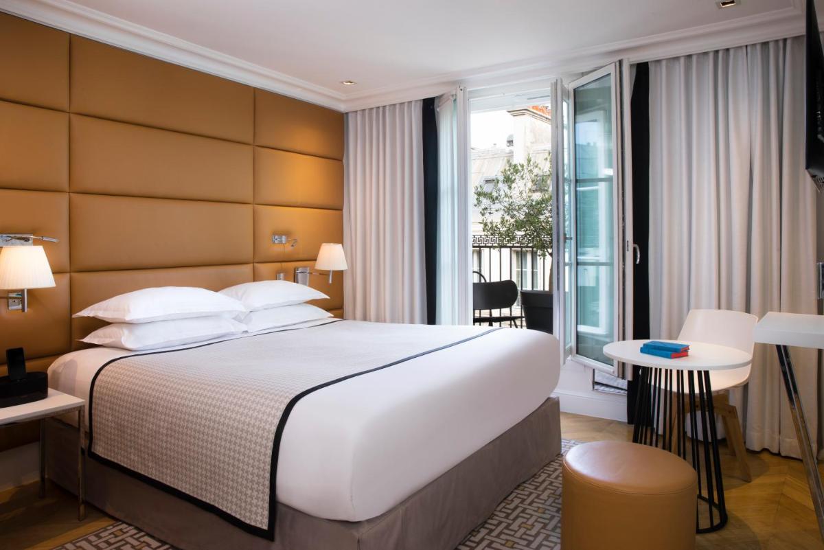 Un ou plusieurs lits dans un hébergement de l'établissement Hôtel R de Paris - Boutique Hotel