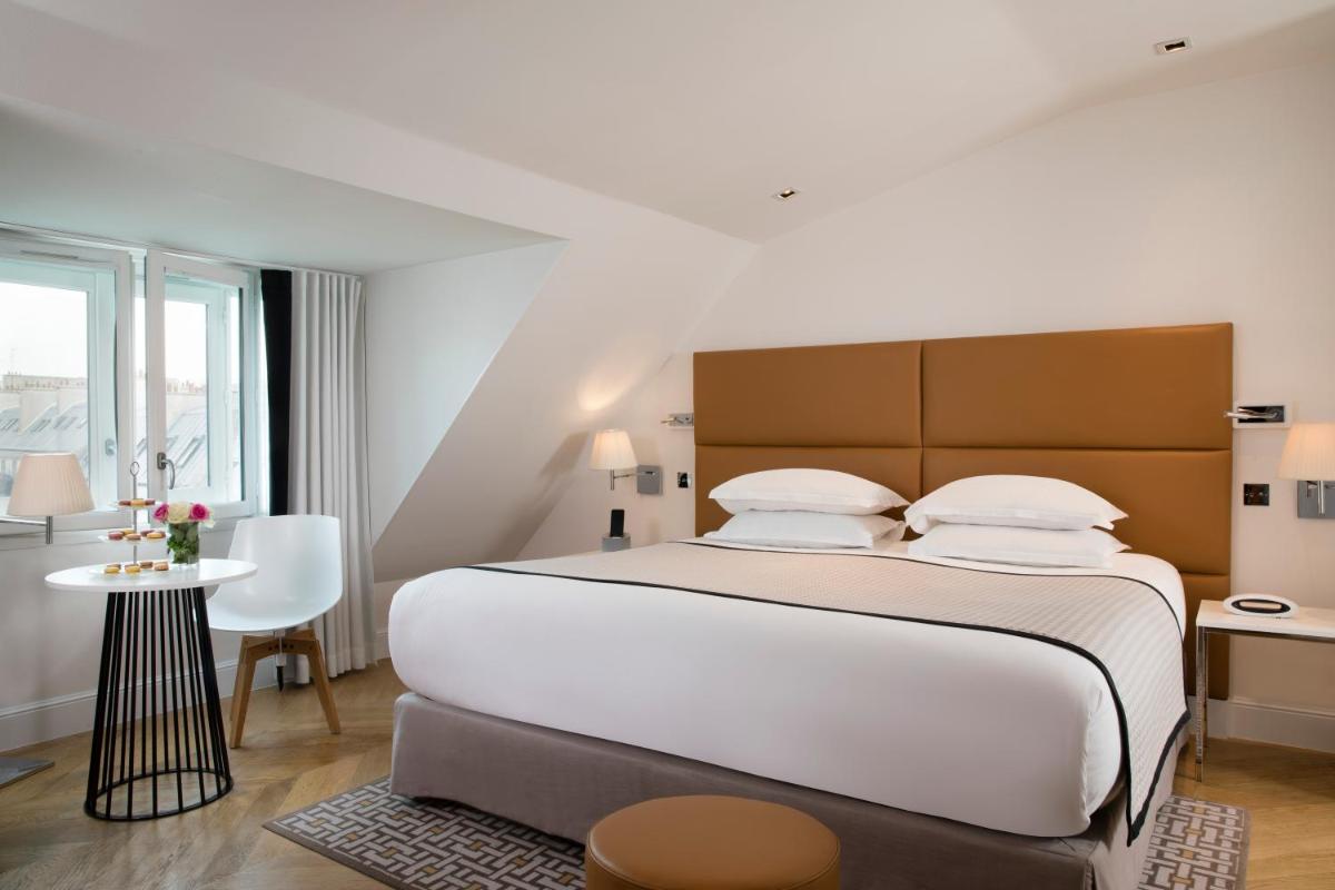 Un ou plusieurs lits dans un hébergement de l'établissement Hôtel R de Paris - Boutique Hotel