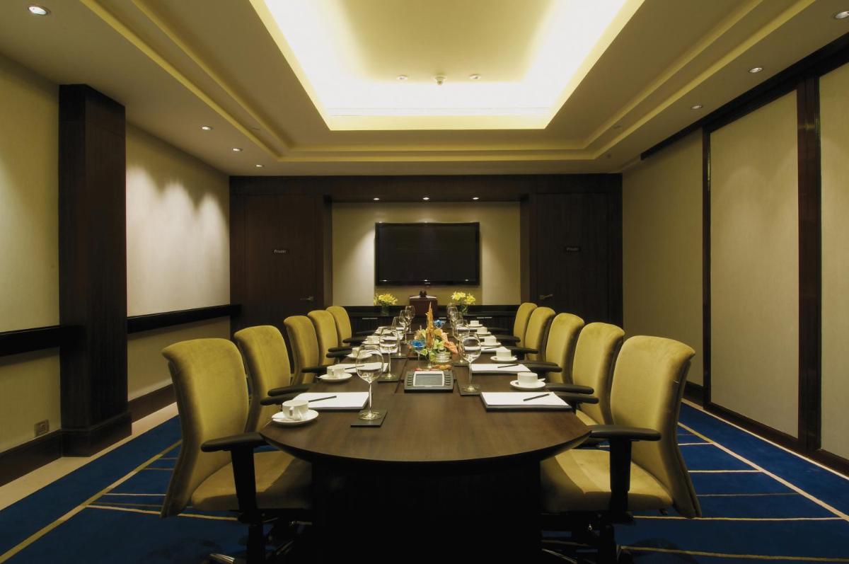 a large conference room with a long table and chairs at Blue Diamond Pune IHCL SeleQtions in Pune +68 photos