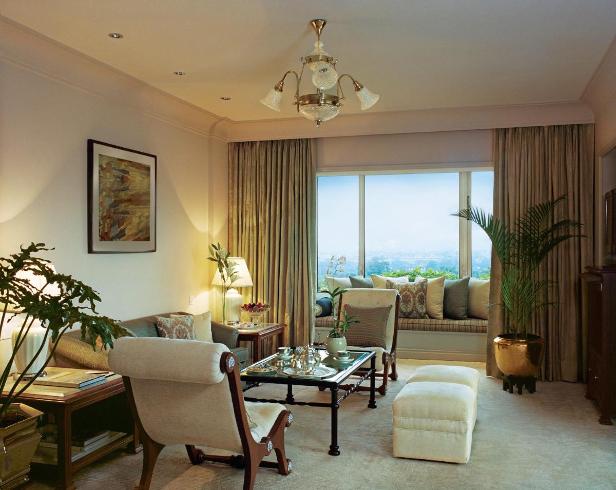 a living room with a couch and a table at Taj Bengal in Kolkata
