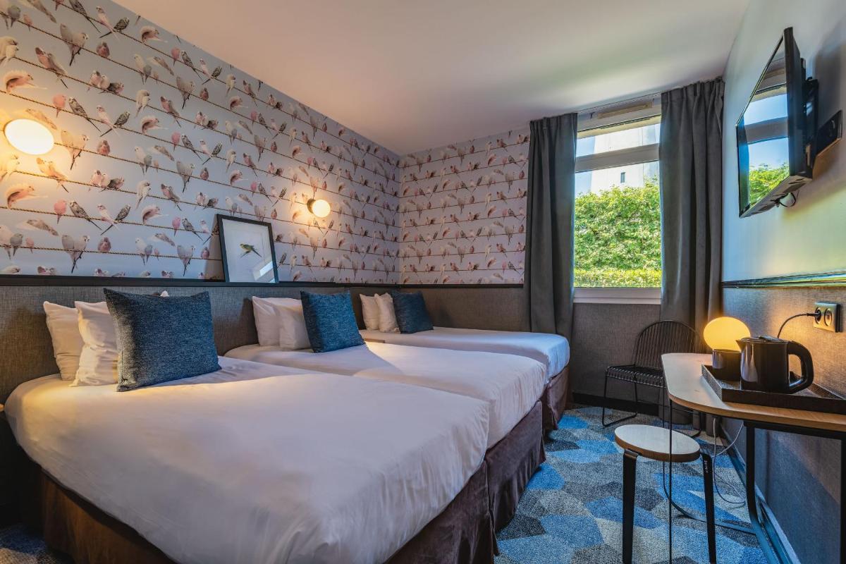 Un ou plusieurs lits dans un hébergement de l'établissement Best Western Hôtel Grand Parc Marne La Vallée