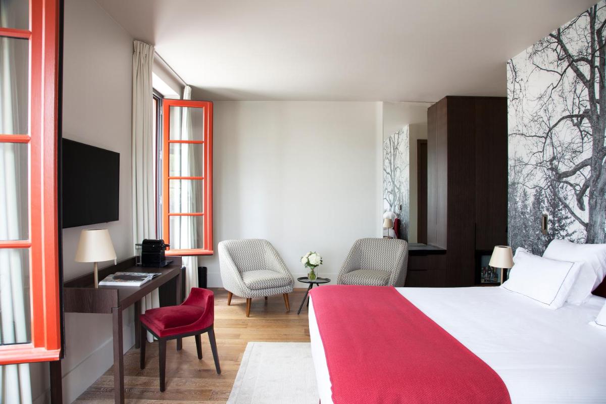 Un ou plusieurs lits dans un hébergement de l'établissement Relais de Chambord, a Small Luxury Hotels of the World