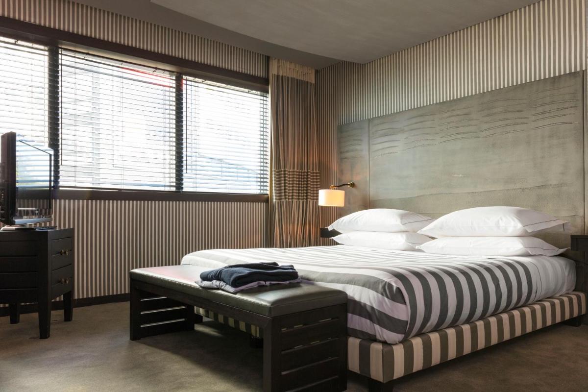 Un ou plusieurs lits dans un hébergement de l'établissement Hotel Square