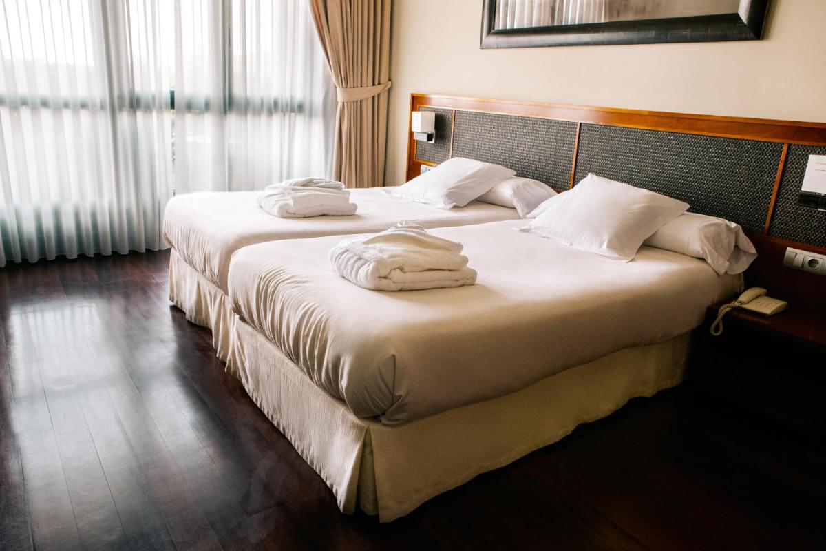 Cama o camas de una habitación en Hosteria de Torazo Nature Hotel & Spa