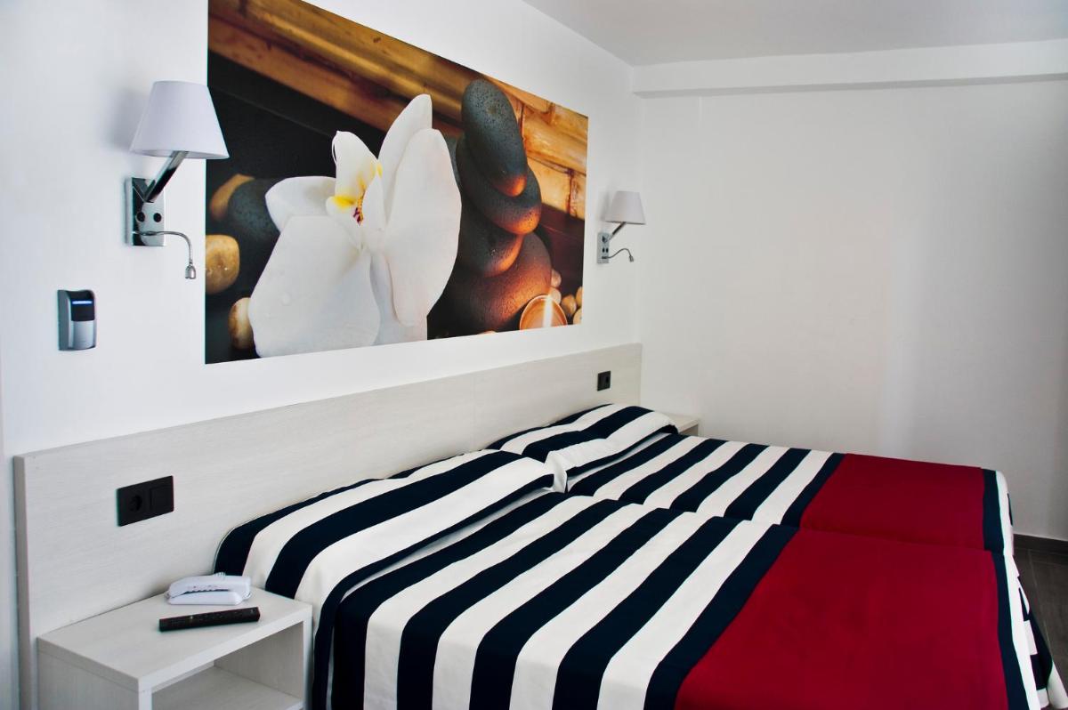 Cama o camas de una habitación en Hotel Europa Splash & Spa