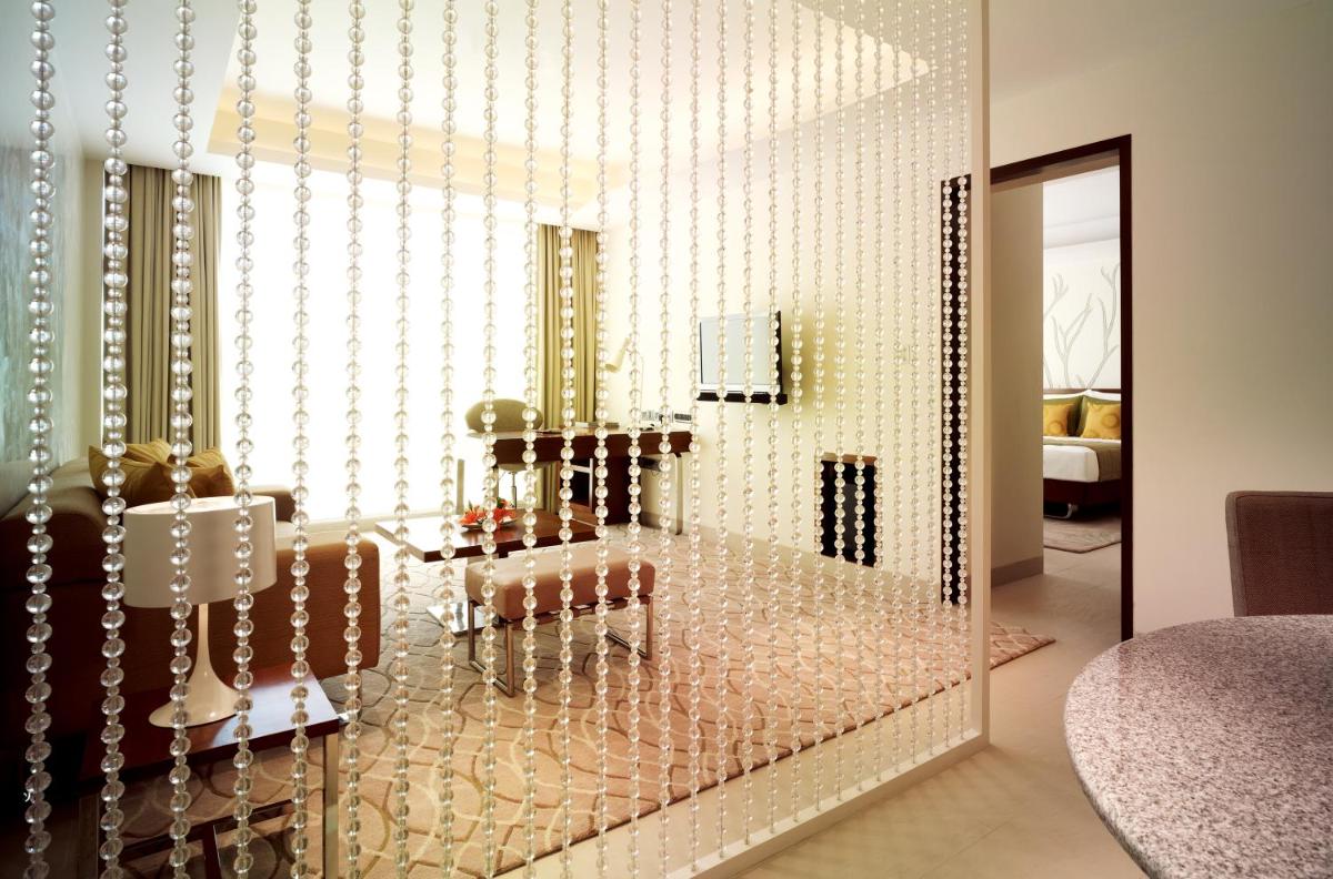 a glass display case in a room with wine bottles at Taj Yeshwantpur Bengaluru in Bengaluru a glass display case in a room with wine bottles at Taj Yeshwantpur Bengaluru in Bengaluru