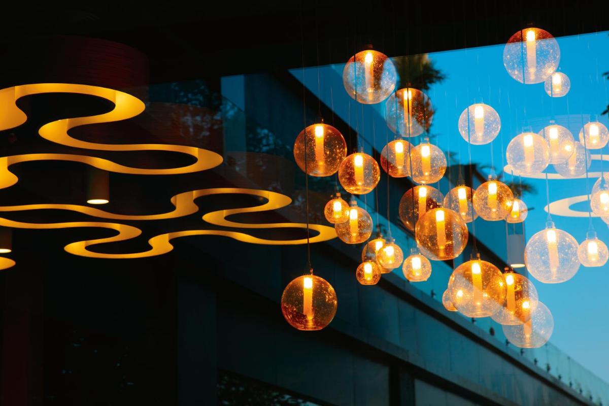 a bunch of lights hanging from a building at Taj Yeshwantpur Bengaluru in Bengaluru a bunch of lights hanging from a building at Taj Yeshwantpur Bengaluru in Bengaluru