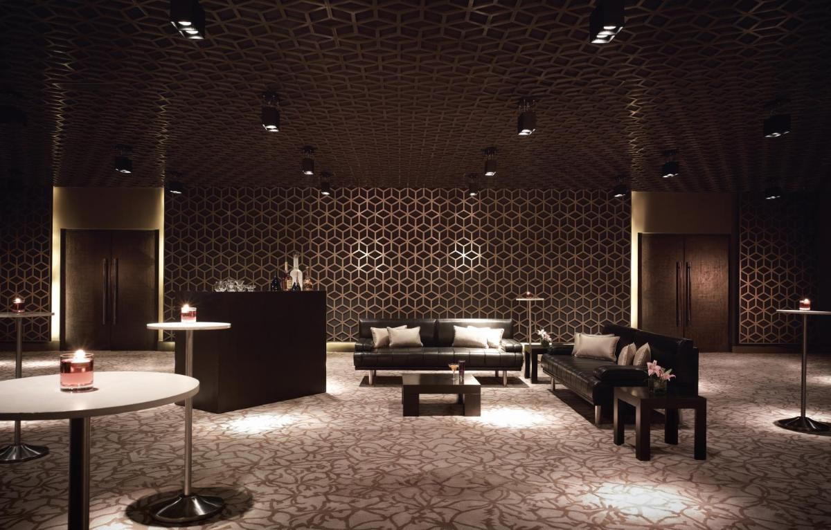 a lobby with couches and tables in a room at Taj Yeshwantpur Bengaluru in Bengaluru a lobby with couches and tables in a room at Taj Yeshwantpur Bengaluru in Bengaluru