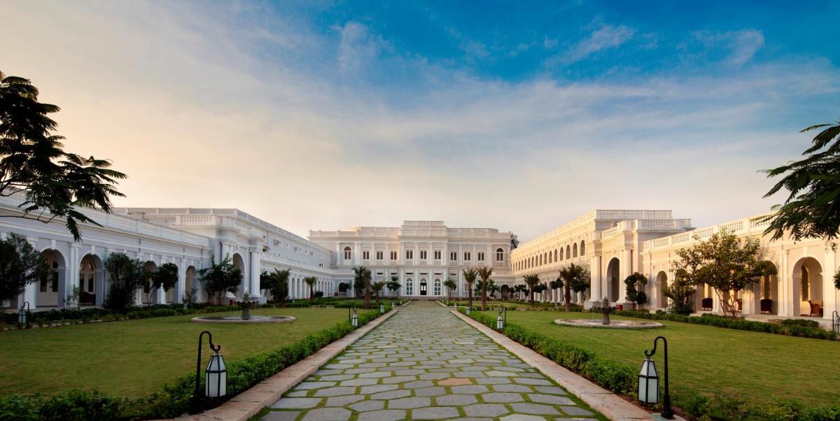 a large white building with a pathway in front at Taj Falaknuma Palace in Hyderabad