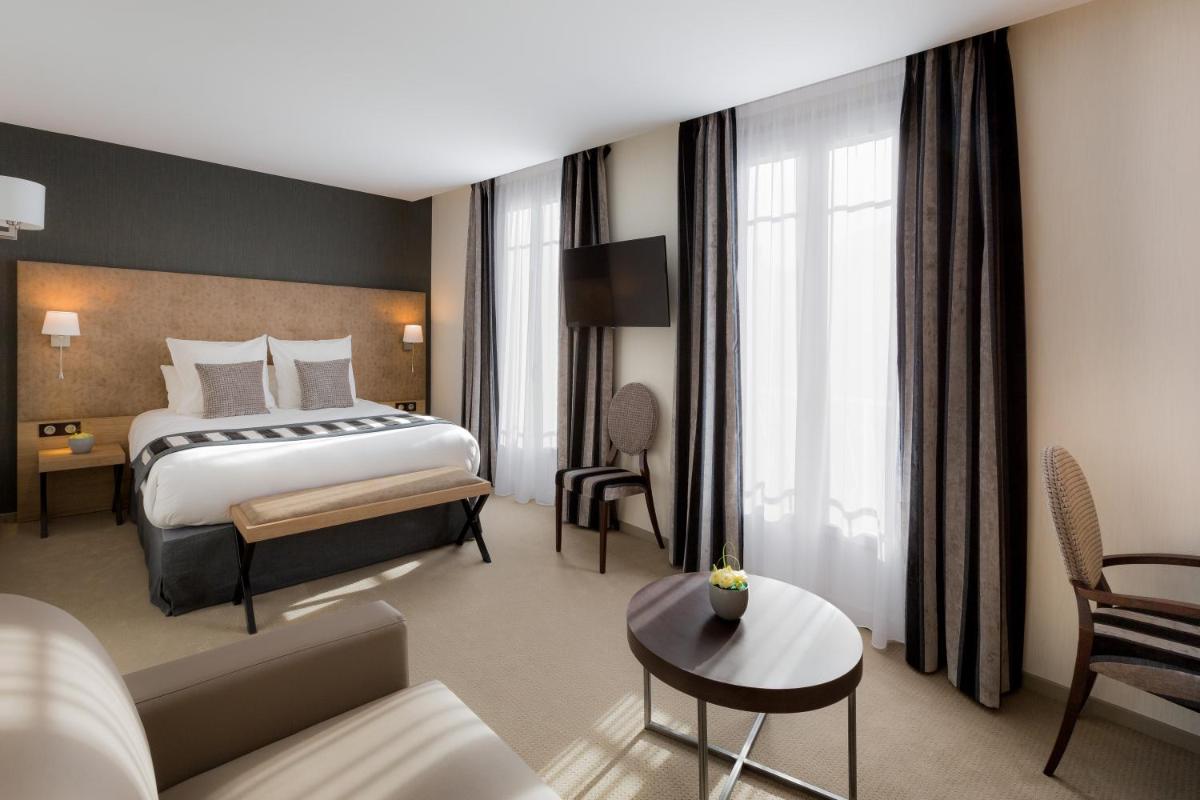 Un ou plusieurs lits dans un hébergement de l'établissement Hôtel Le Rive Droite & SPA