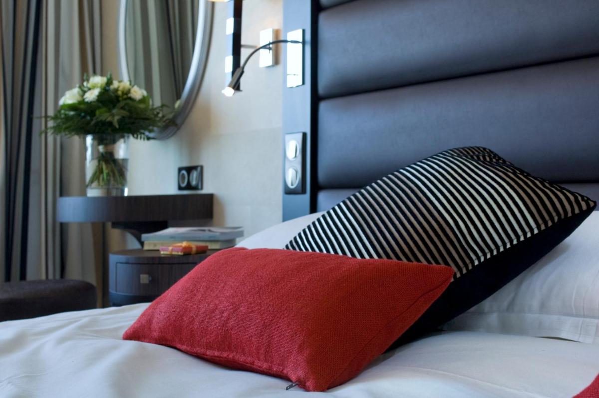 Un ou plusieurs lits dans un hébergement de l'établissement Grand Hôtel Des Thermes