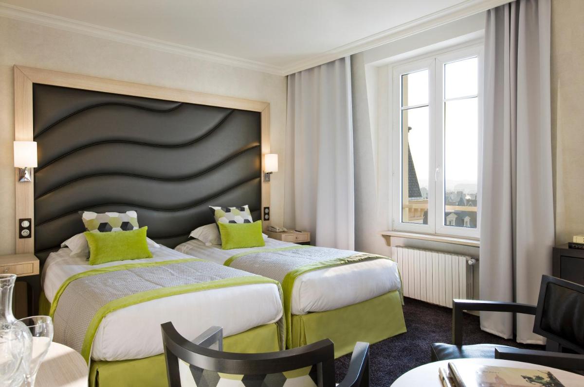 Un ou plusieurs lits dans un hébergement de l'établissement Grand Hôtel Des Thermes
