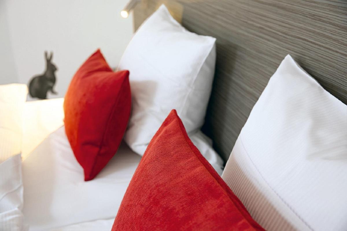 Ein Bett oder Betten in einem Zimmer der Unterkunft Hotel Traube Tonbach