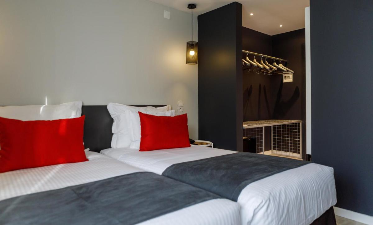 Uma cama ou camas num quarto em Sport Hotel Gym + SPA