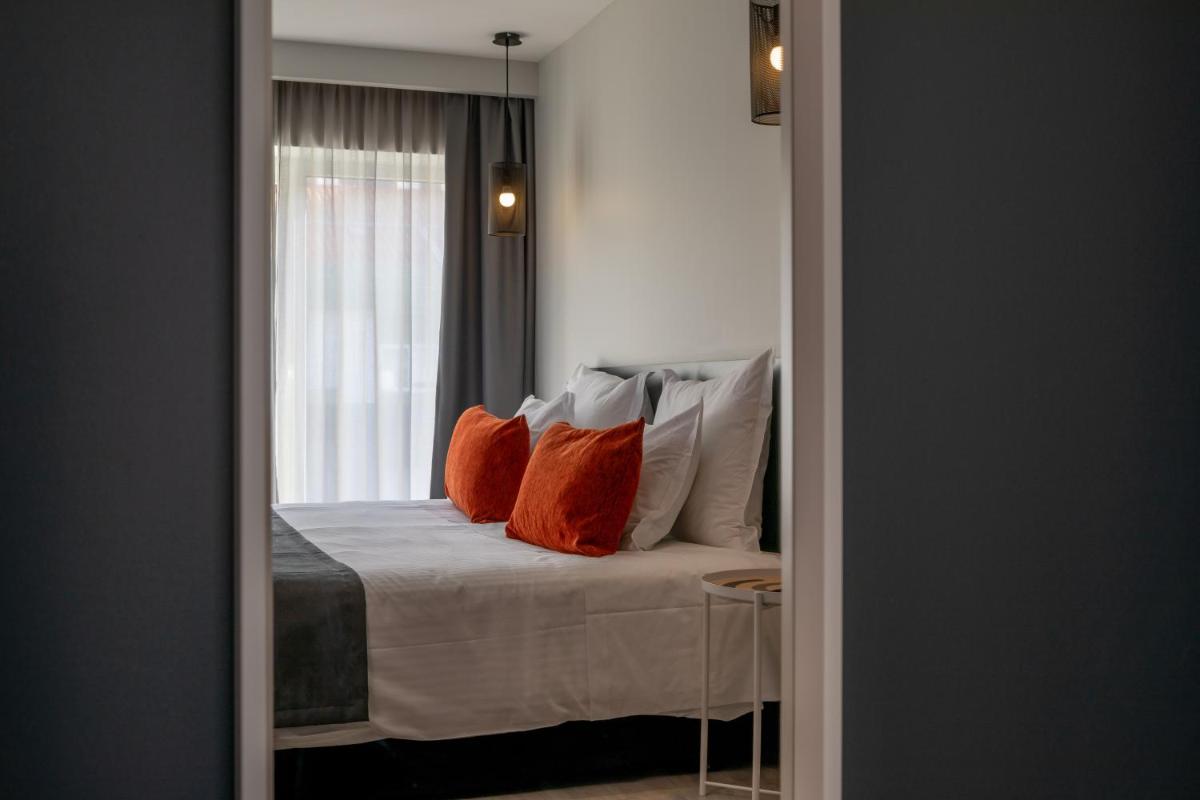 Uma cama ou camas num quarto em Sport Hotel Gym + SPA