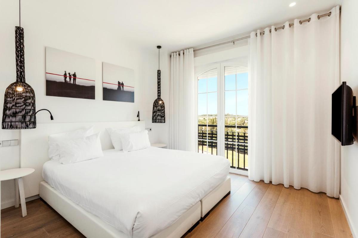 Cama o camas de una habitación en Ama Islantilla Resort