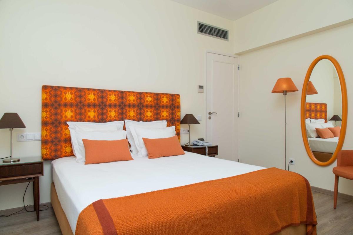 Uma cama ou camas num quarto em Aires da Serra Hotel