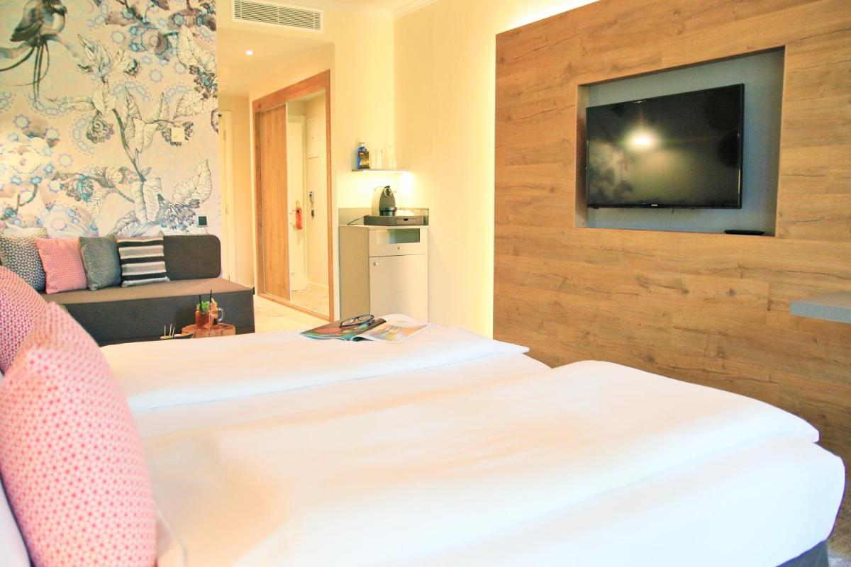 Cama o camas de una habitación en Lindner Hotel Mallorca Portals Nous, part of JdV by Hyatt
