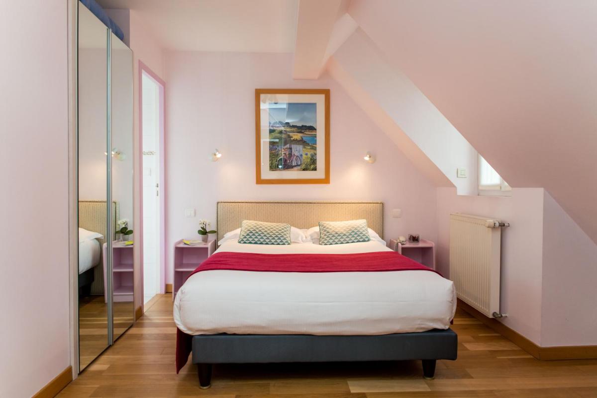 Un ou plusieurs lits dans un hébergement de l'établissement Hôtel Lutétia & Spa
