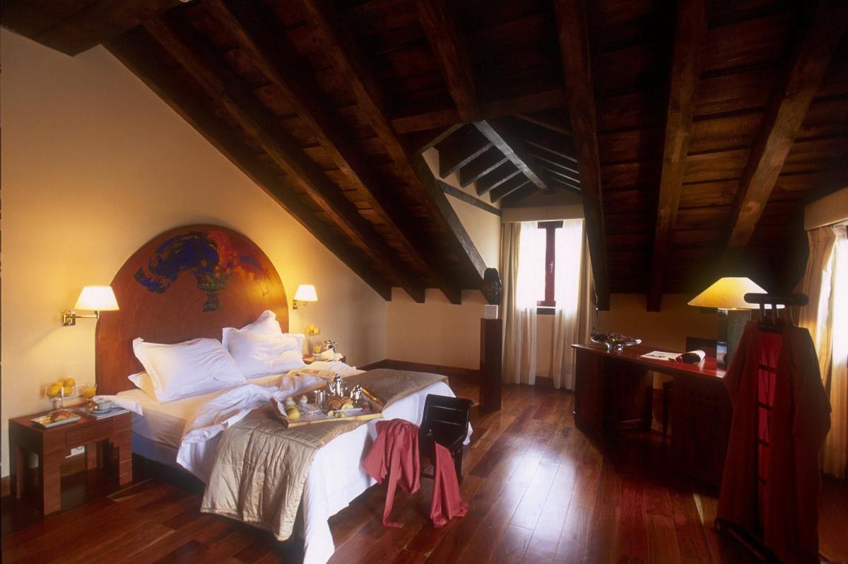 Cama o camas de una habitación en Hotel El Rancho