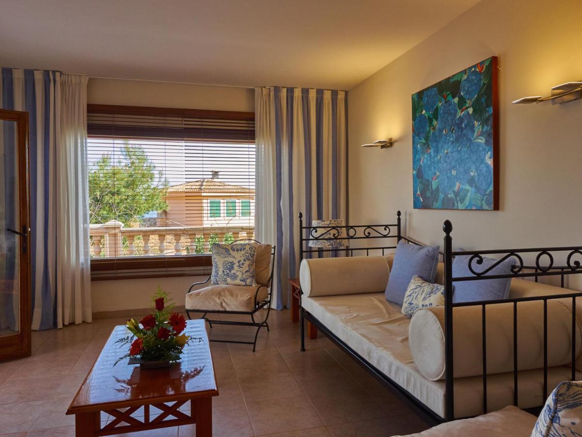 Cama o camas de una habitación en Hotel Petit Cala Fornells