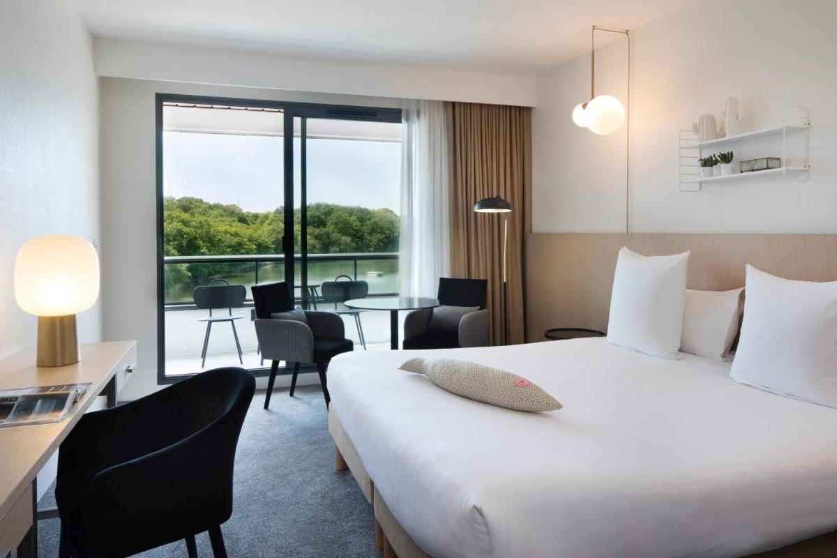 Un ou plusieurs lits dans un hébergement de l'établissement Best Western Plus Hotel les Rives du Ter