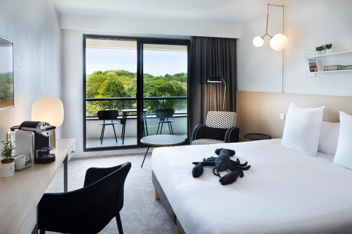 Un ou plusieurs lits dans un hébergement de l'établissement Best Western Plus Hotel les Rives du Ter