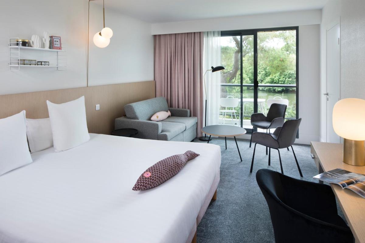 Un ou plusieurs lits dans un hébergement de l'établissement Best Western Plus Hotel les Rives du Ter