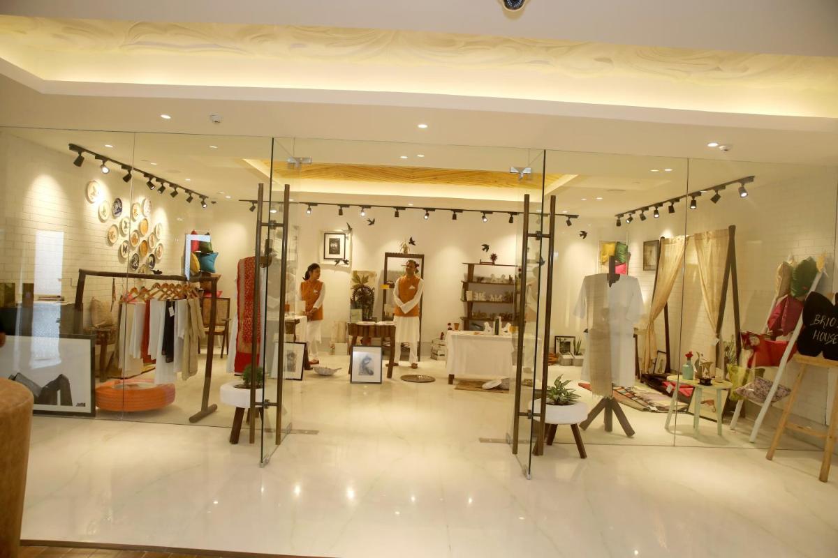 a clothing store with a lot of clothes on display at Ramada by Wyndham Lucknow Hotel and Convention Center in Lucknow