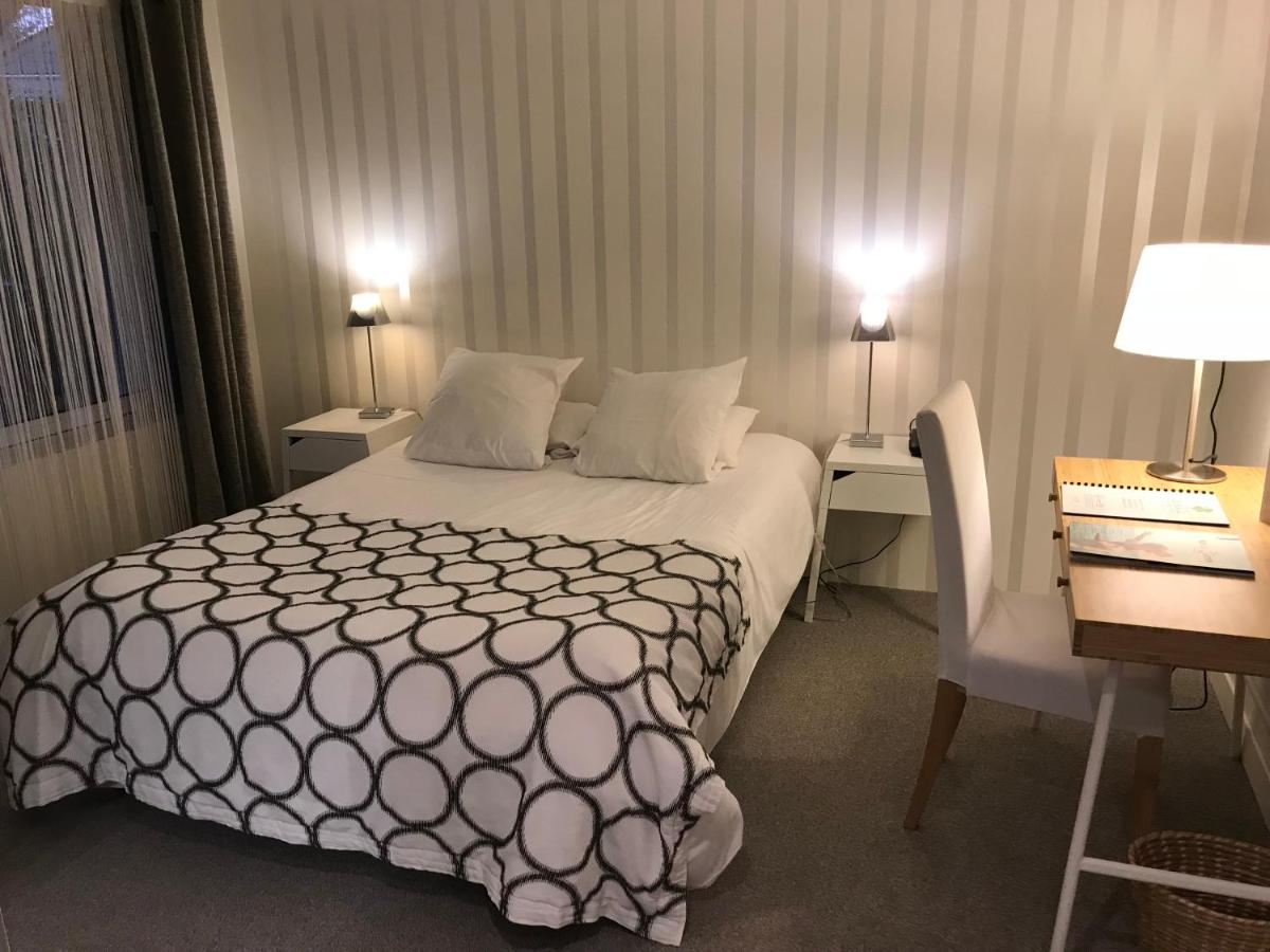 Un ou plusieurs lits dans un hébergement de l'établissement Carnac Lodge Hotel & Spa