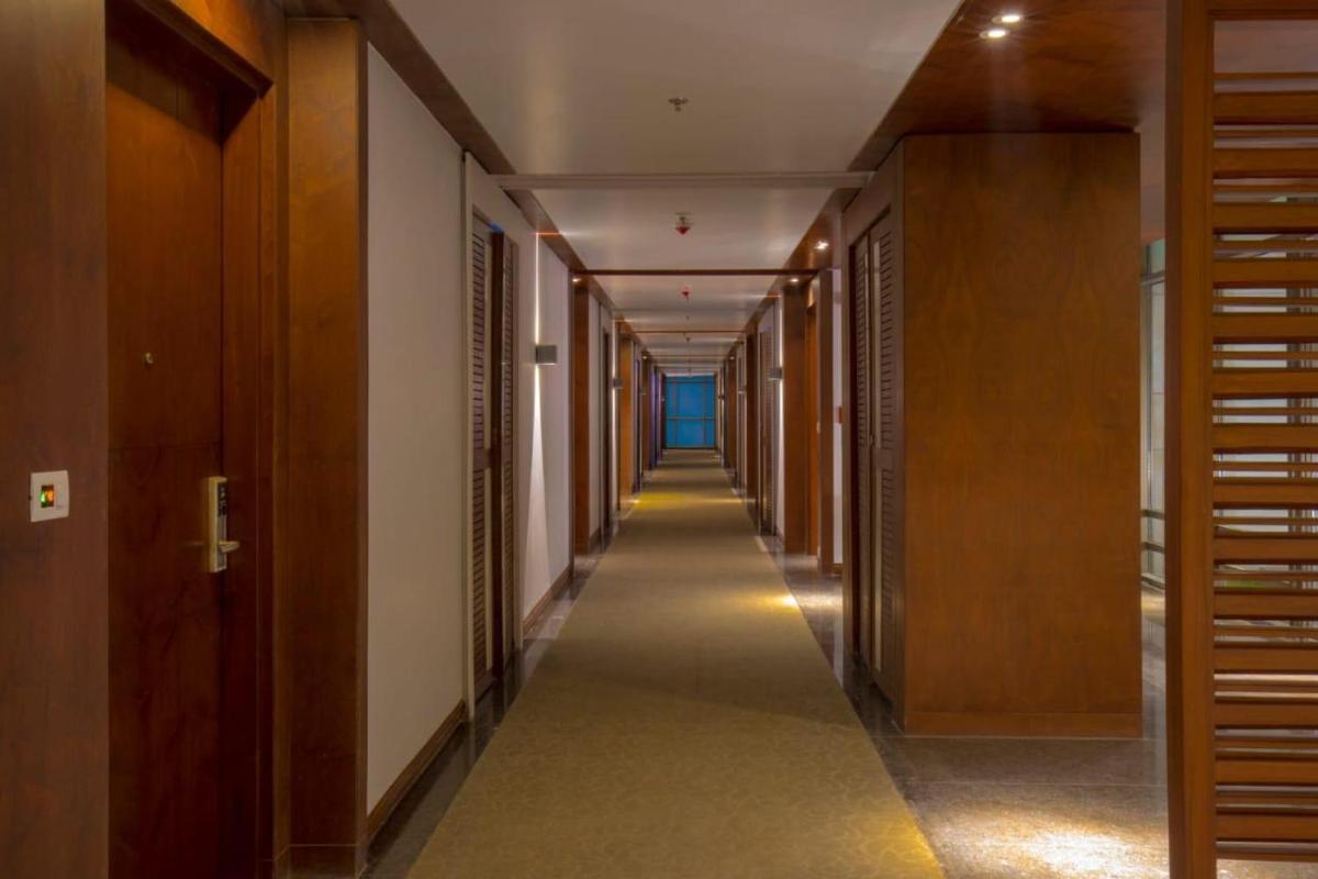 a hallway of a building with a long corridor at Zone By The Park Kolkata, Newtown in Kolkata