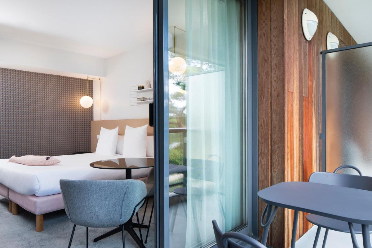 Un ou plusieurs lits dans un hébergement de l'établissement Best Western Plus Hotel les Rives du Ter