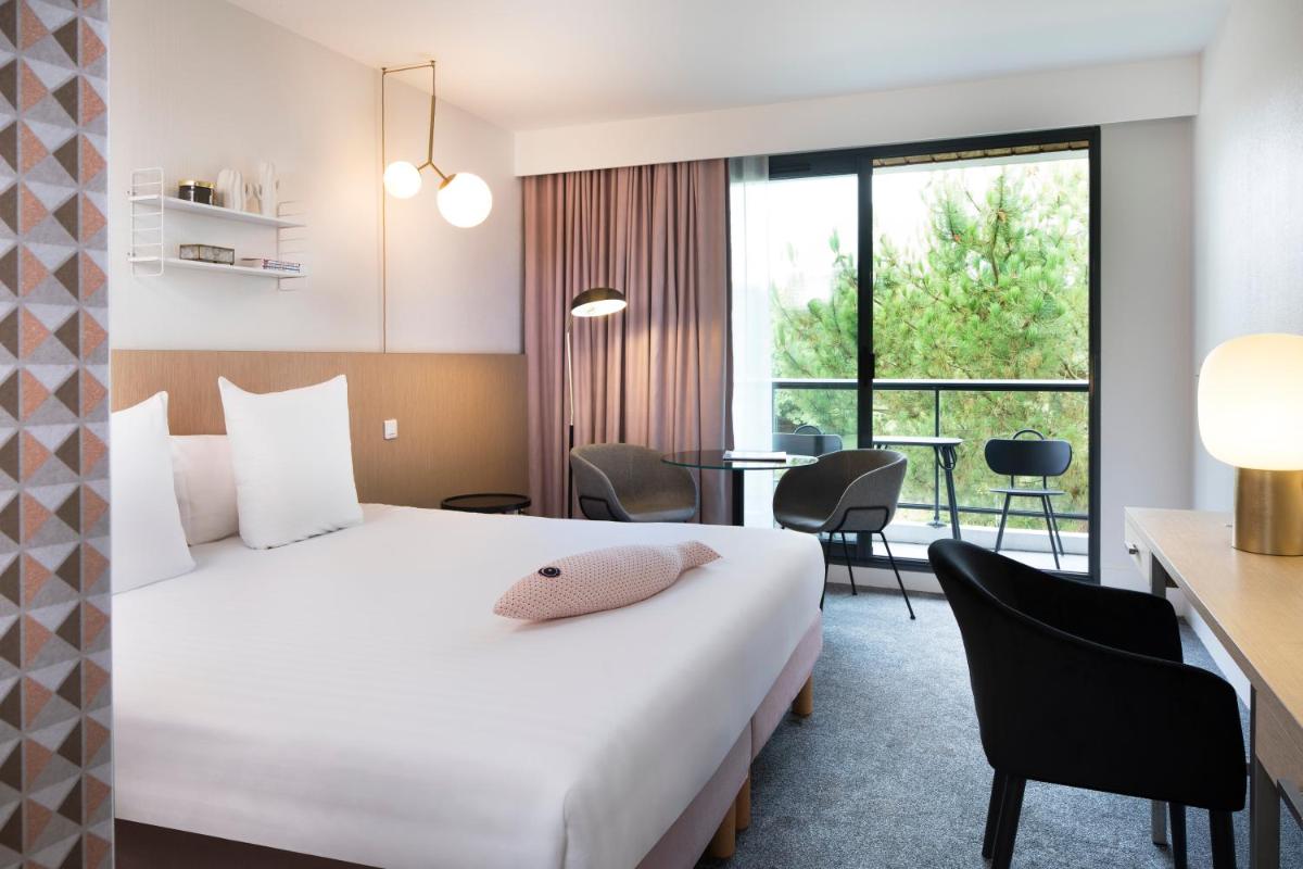 Un ou plusieurs lits dans un hébergement de l'établissement Best Western Plus Hotel les Rives du Ter