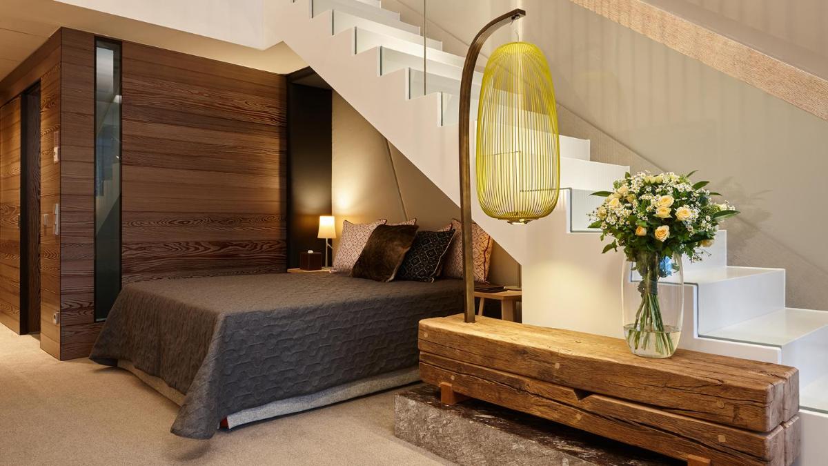 Ein Bett oder Betten in einem Zimmer der Unterkunft Kempinski Hotel Berchtesgaden
