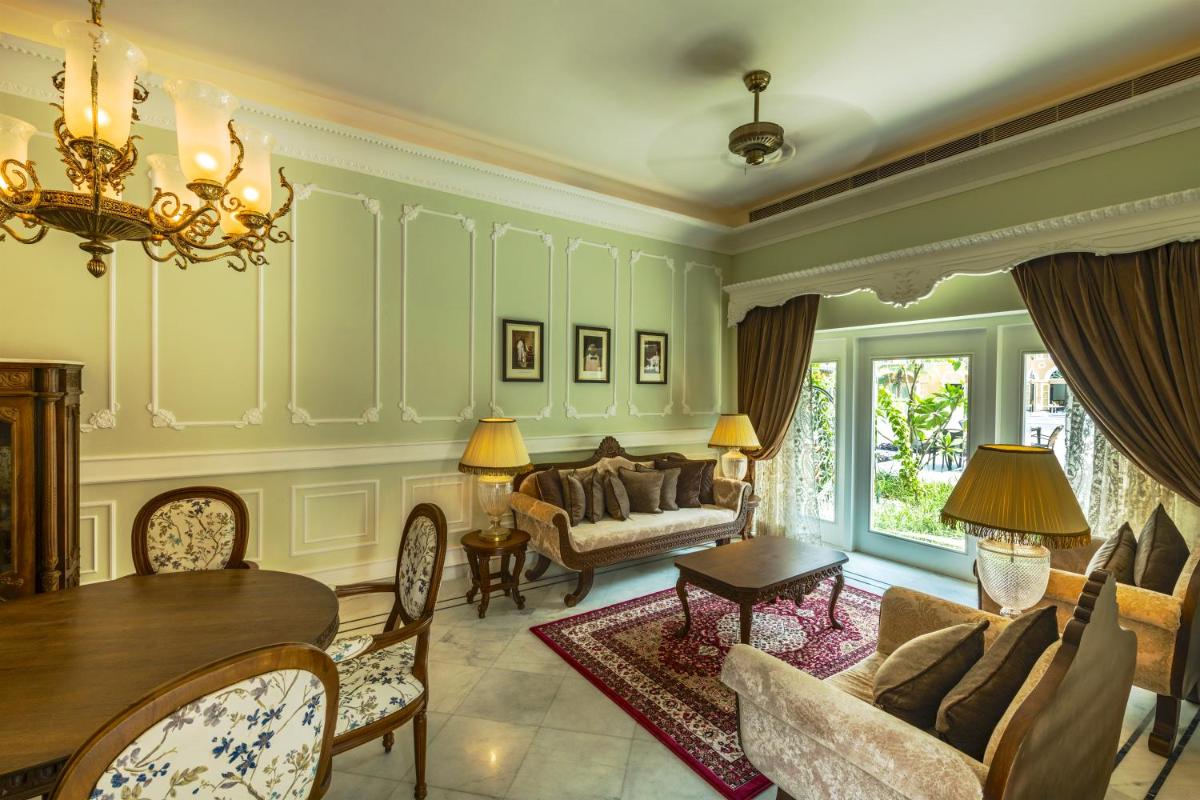a living room filled with furniture and a table at Raajkutir - IHCL SeleQtions in Kolkata