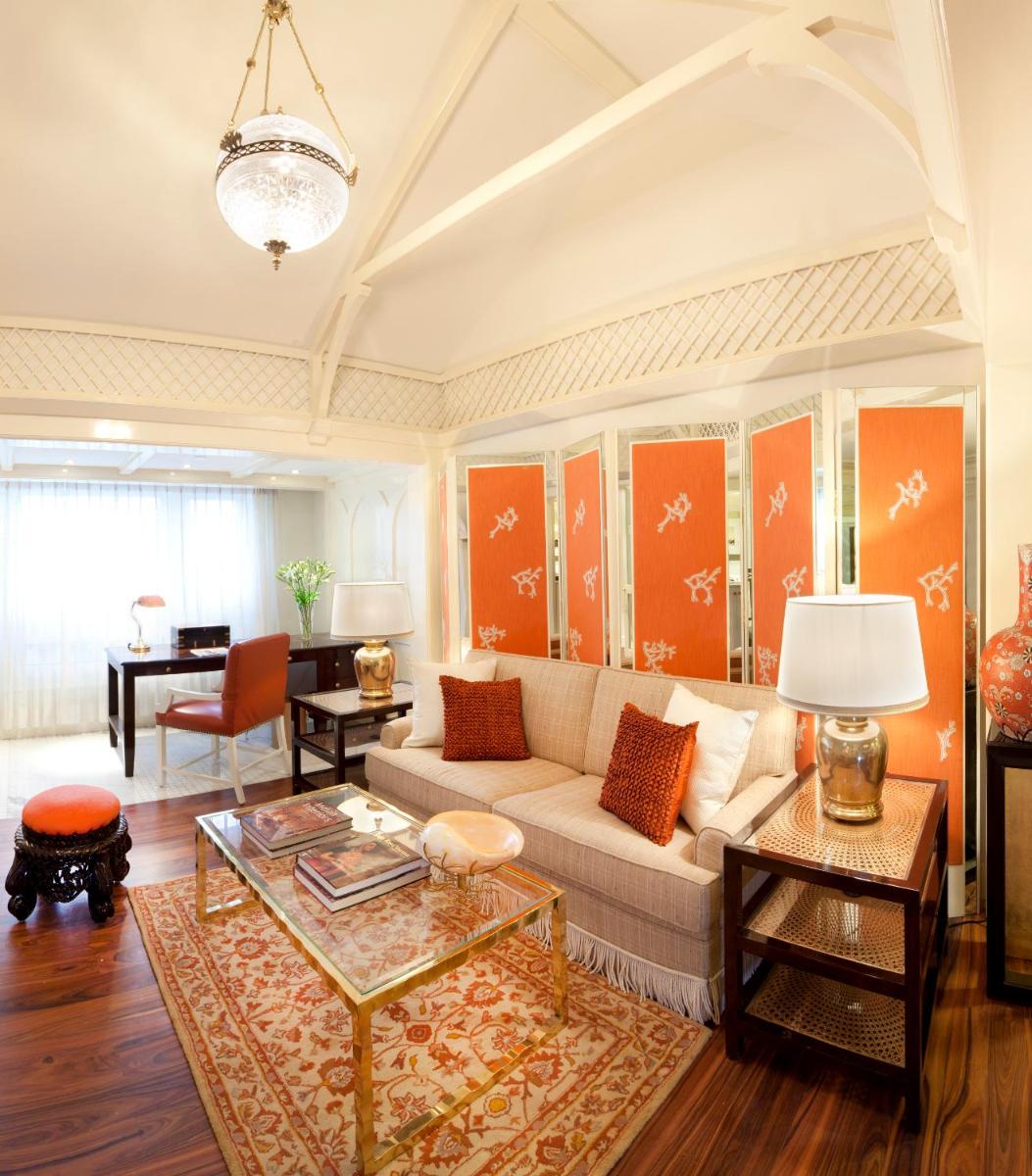 a living room with a couch and a table at The Taj Mahal Palace, Mumbai in Mumbai a living room with a couch and a table at The Taj Mahal Palace, Mumbai in Mumbai