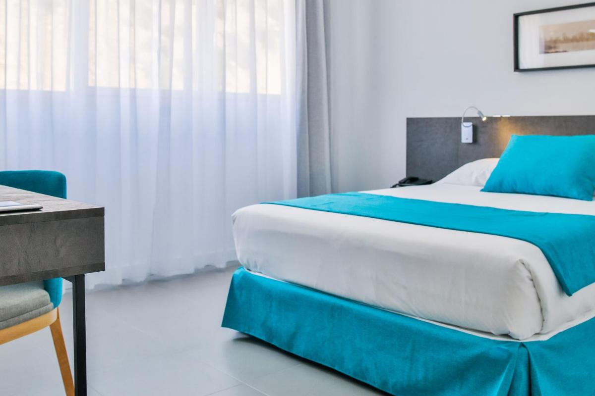 Cama o camas de una habitación en Moon Hotel & SPA.