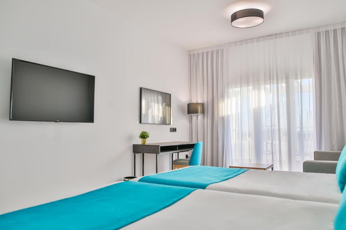 Cama o camas de una habitación en Moon Hotel & SPA.
