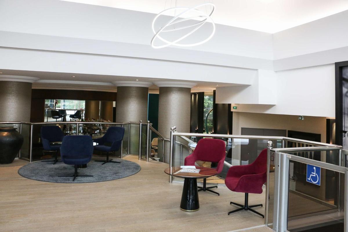 Coin salon dans l'établissement Best Western Plus Hotel Admiral