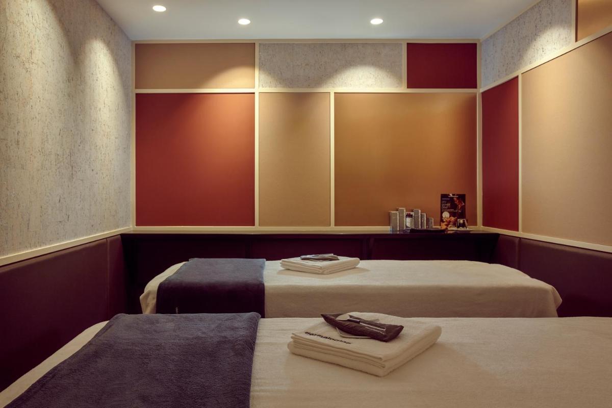 Un ou plusieurs lits dans un hébergement de l'établissement Mercure Paris Opera Garnier Hôtel & Spa