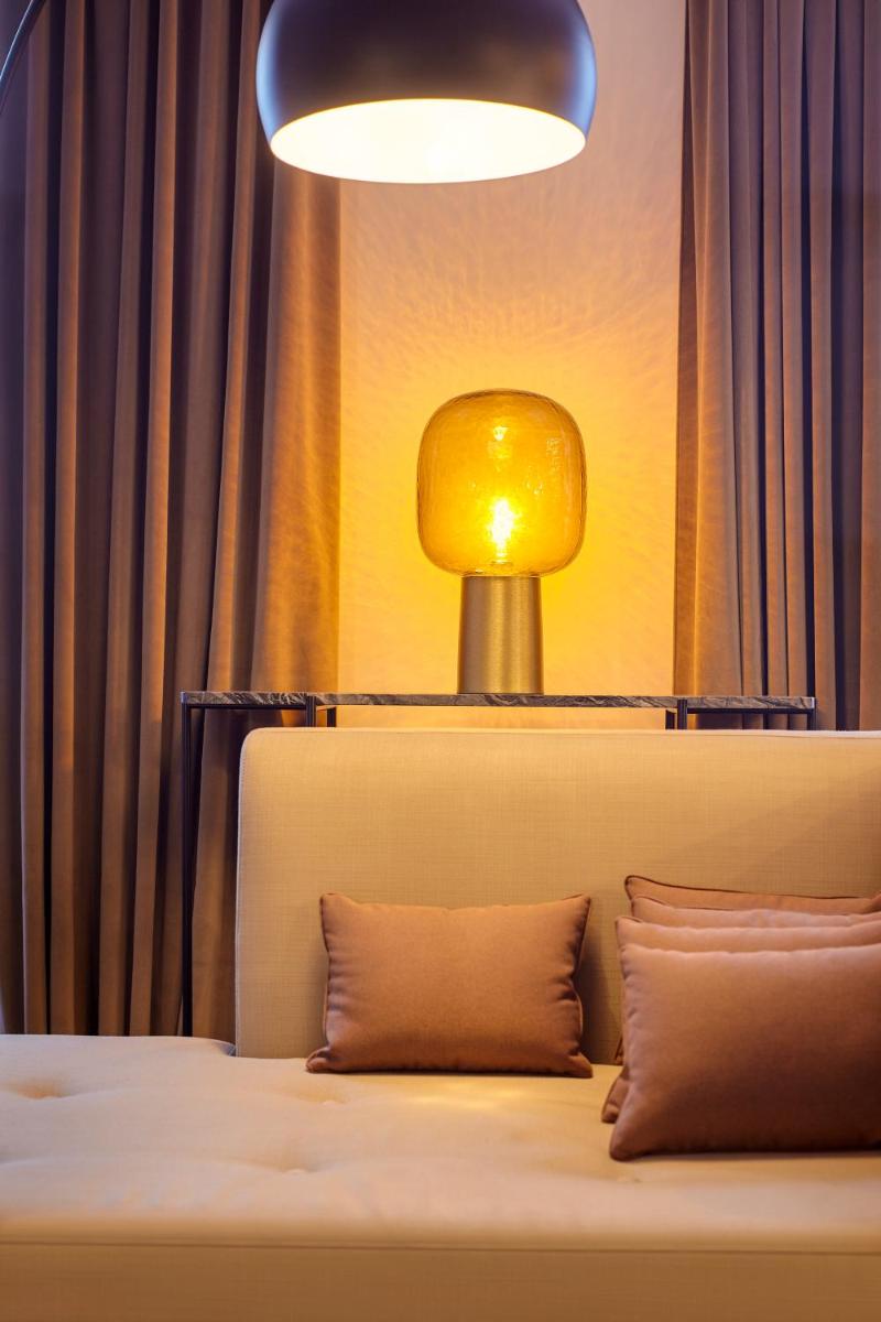 Un ou plusieurs lits dans un hébergement de l'établissement Mercure Paris Opera Garnier Hôtel & Spa