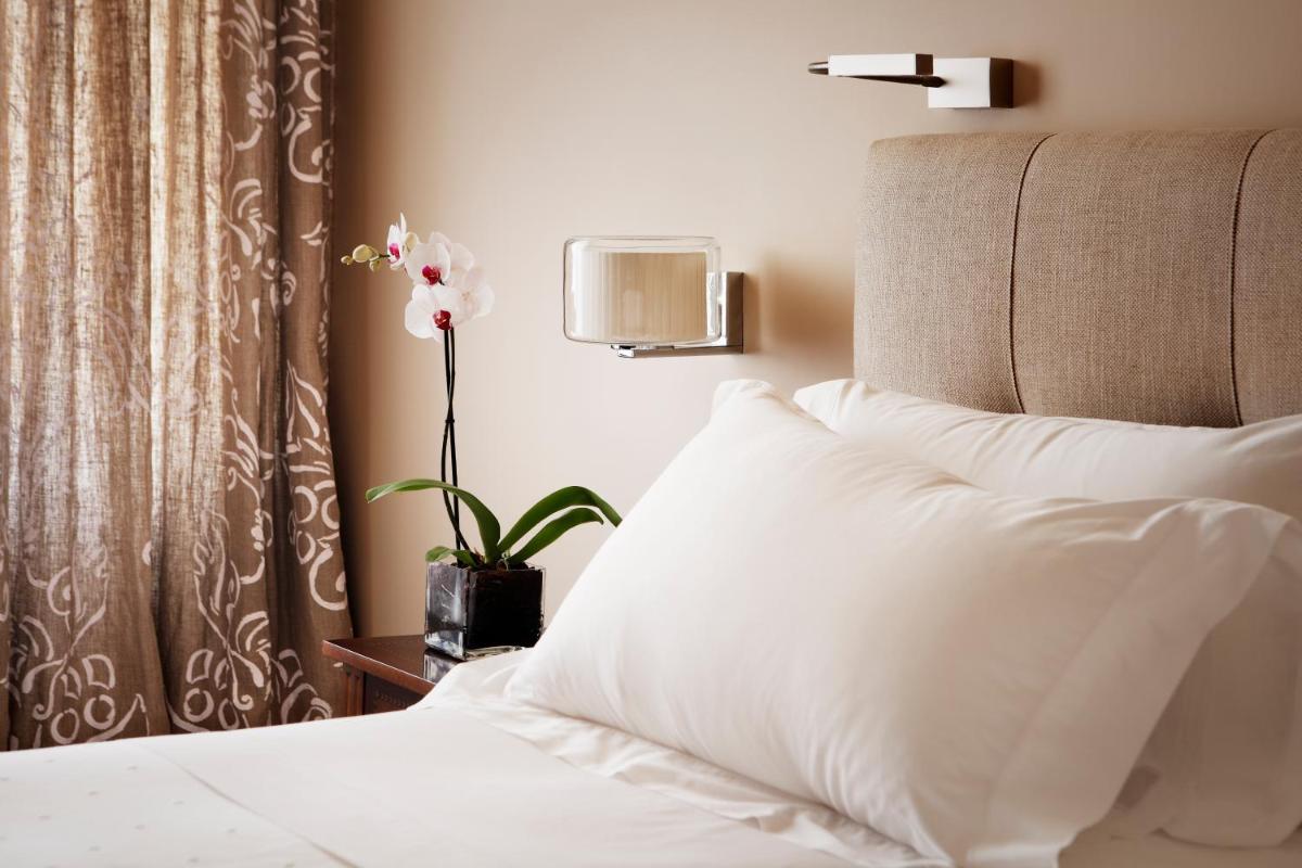 Cama o camas de una habitación en Hotel Rector