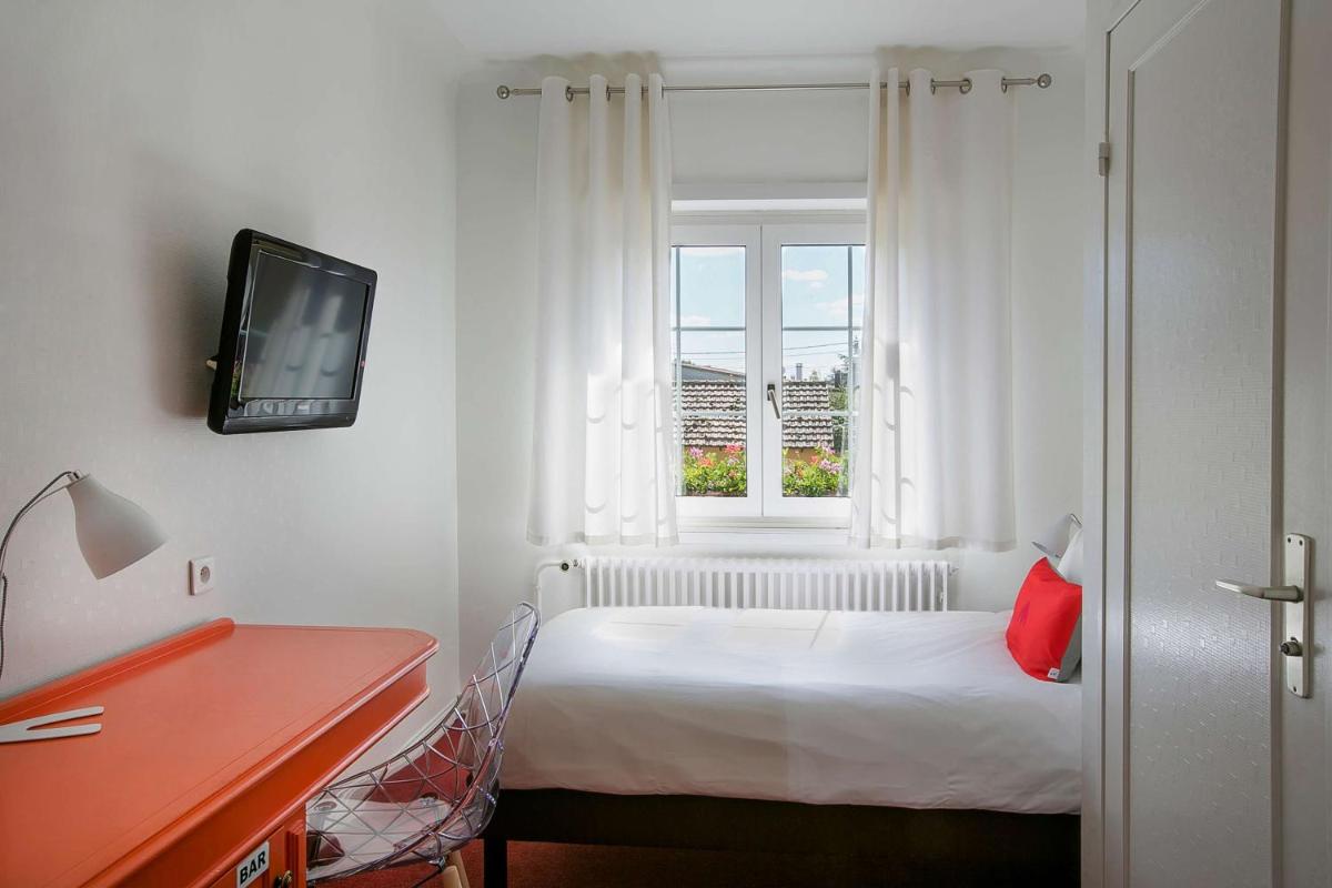 Un ou plusieurs lits dans un hébergement de l'établissement Best Western Plus Au cheval Blanc à Mulhouse