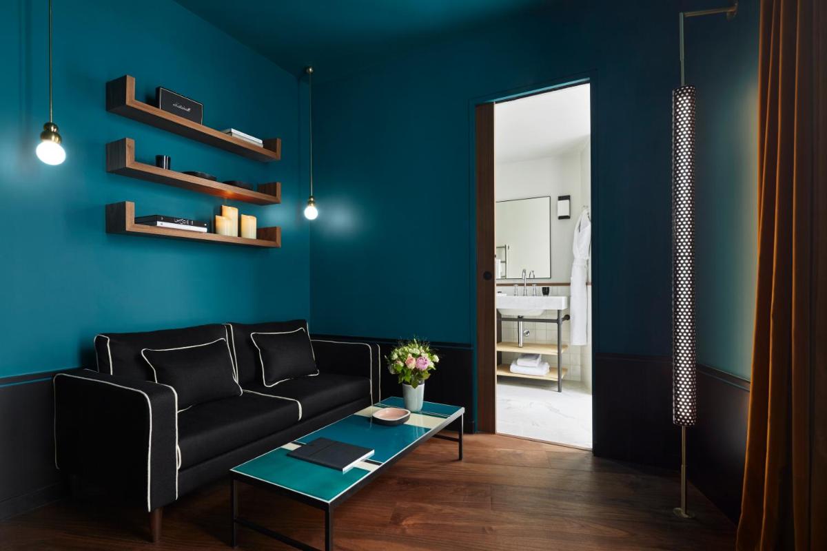 Coin salon dans l'établissement Le Roch Hotel & Spa