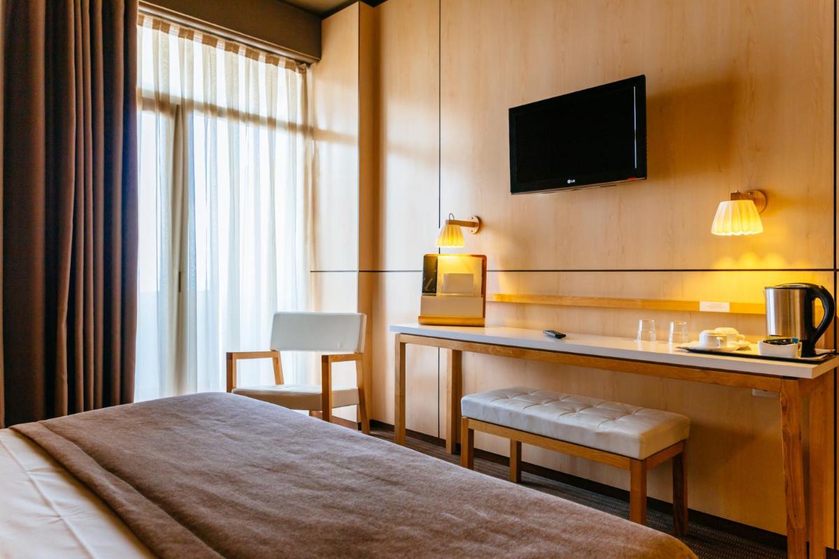 Uma cama ou camas num quarto em Axis Vermar Conference & Beach Hotel