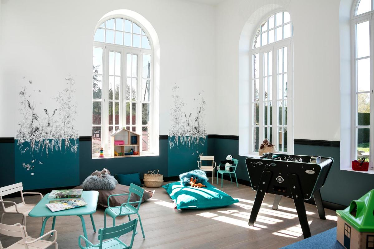 Coin salon dans l'établissement Les Hauts de Loire Relais & Châteaux