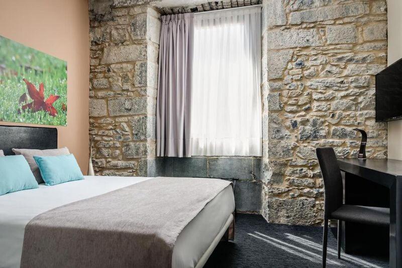 Cama o camas de una habitación en Hotel Balneario Orduña Plaza