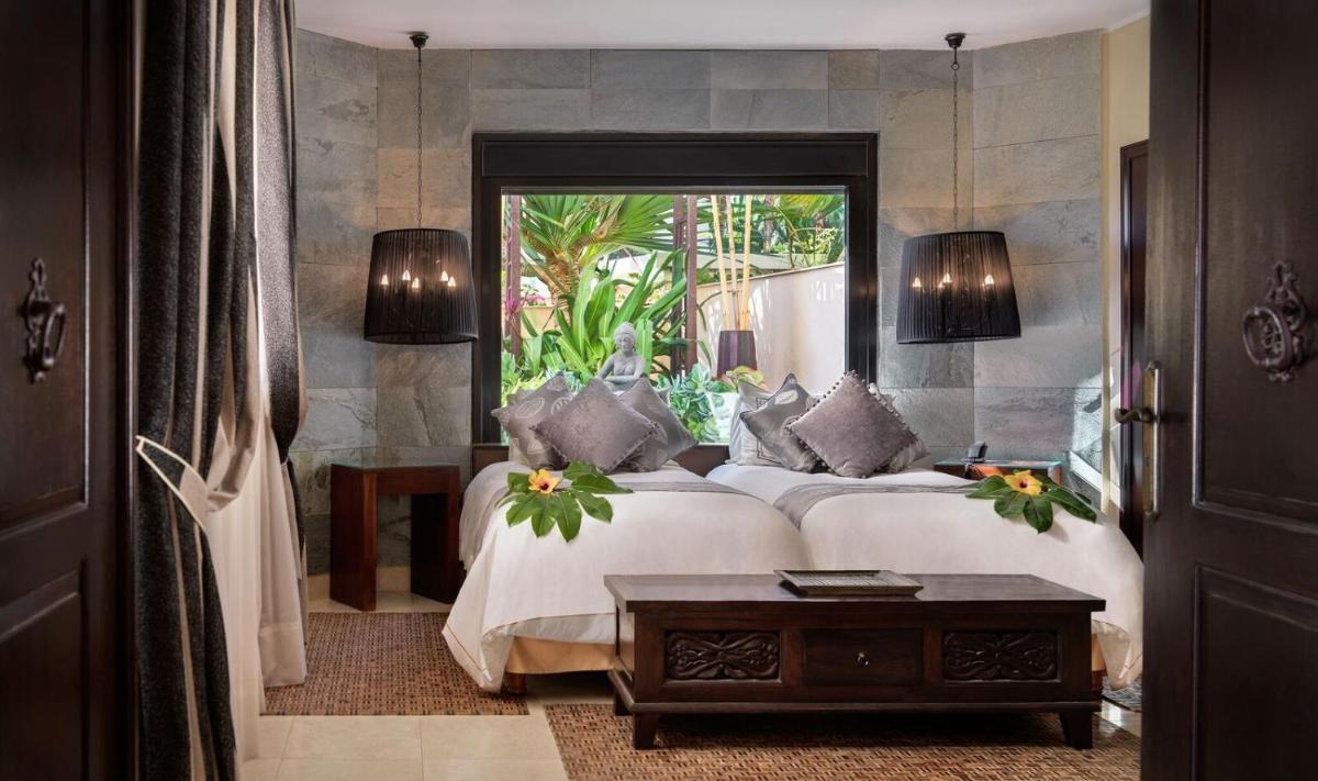 Cama o camas de una habitación en Royal Garden Villas, Luxury Hotel
