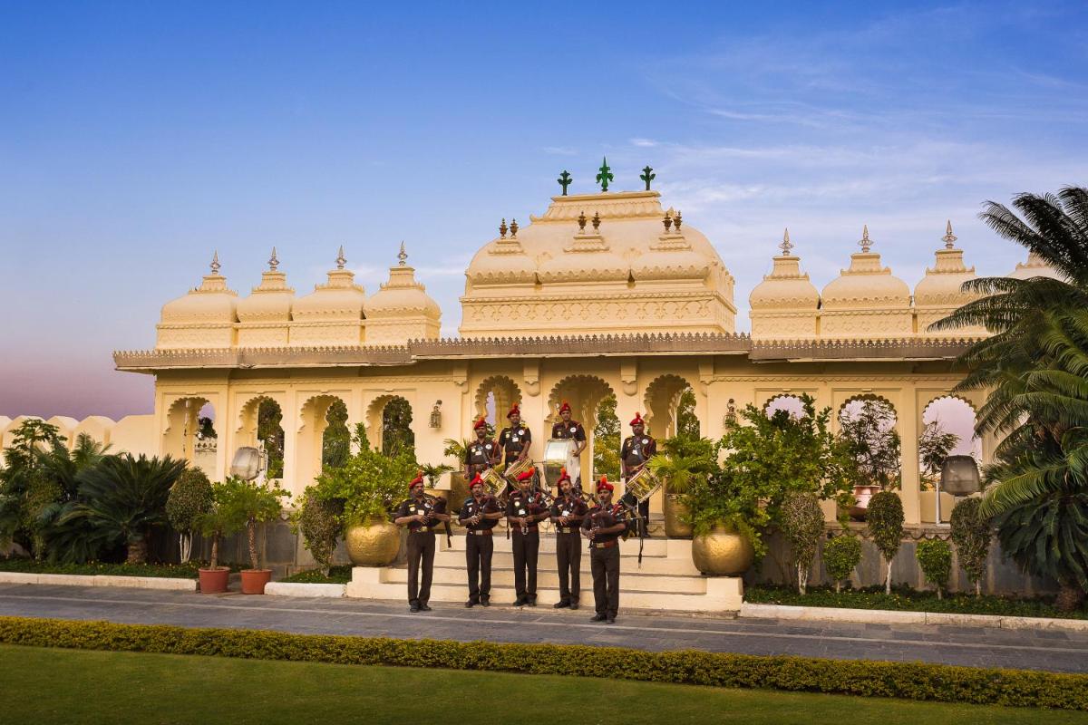 a group of soldiers standing in front of a building at Shiv Niwas Palace by HRH Group of Hotels in Udaipur